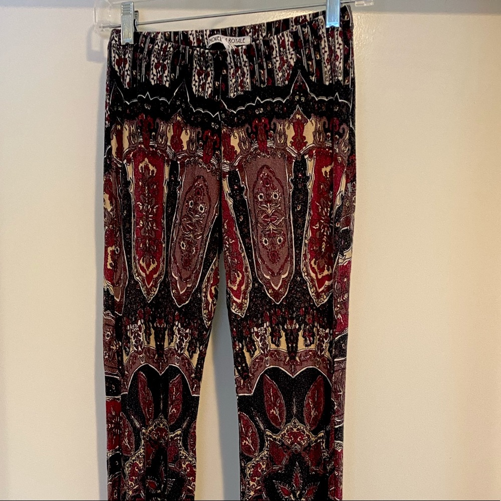 Novella Royale bell bottom pants. 90% rayon and 10% spandex. Size M